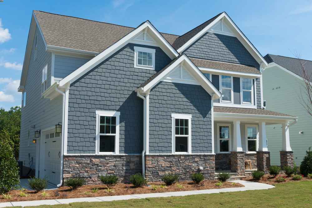 residential house in Bradenton with new roofing system, gutter and siding